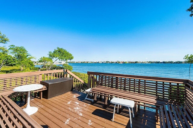 deck featuring a water view