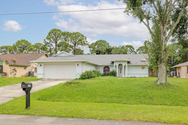 single story home with a garage, central AC, and a front yard