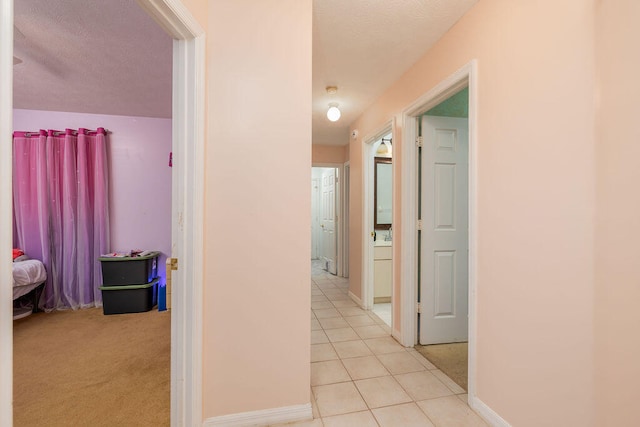 hall with light tile patterned flooring