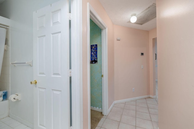 hallway with light tile patterned floors