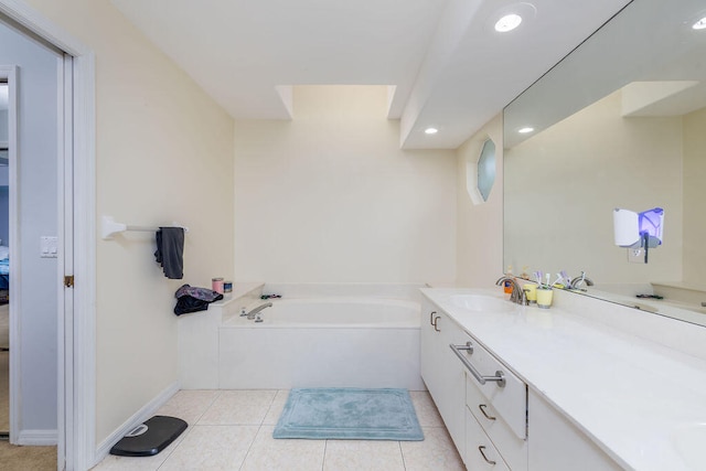 bathroom with vanity, a tub to relax in, and tile patterned floors