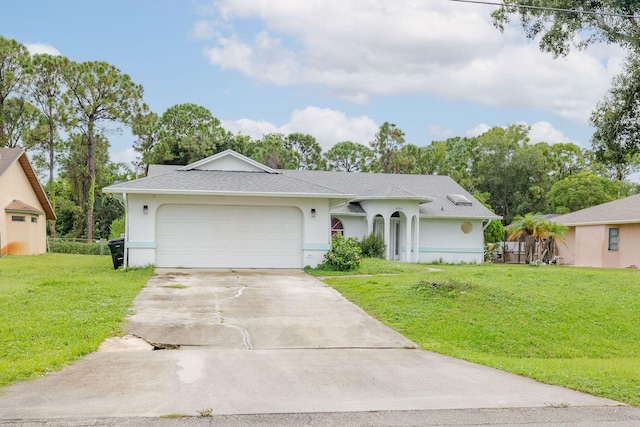 single story home with a garage and a front lawn