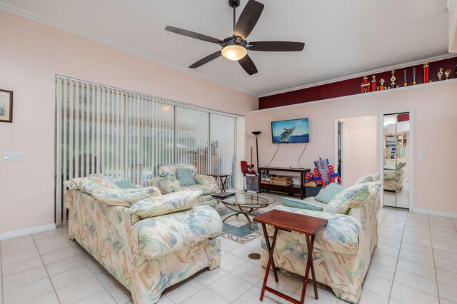 living room featuring ceiling fan, ornamental molding, and light tile patterned floors