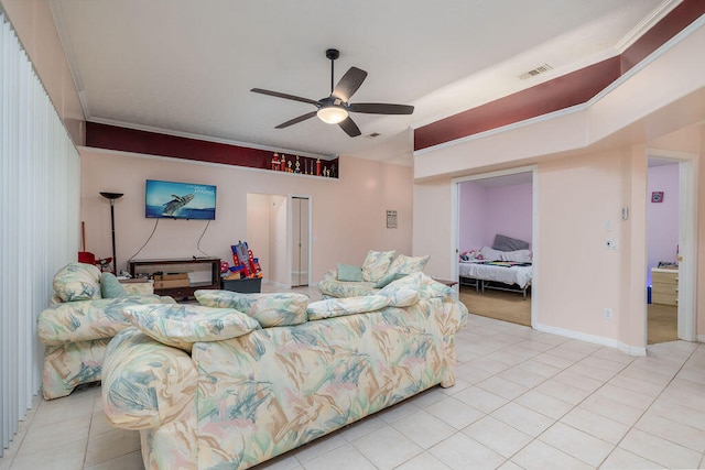 living room with ceiling fan and light tile patterned floors