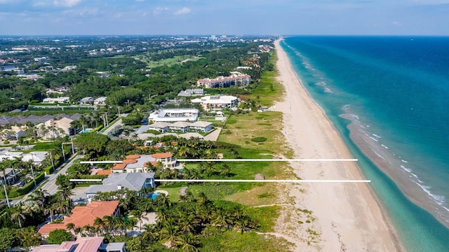 drone / aerial view with a view of the beach and a water view