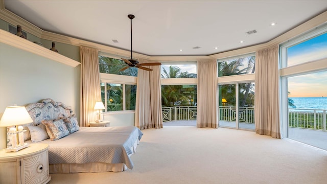 bedroom featuring access to outside, ornamental molding, carpet flooring, a water view, and ceiling fan