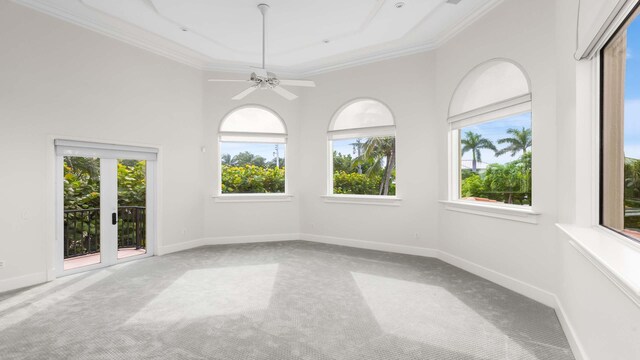 balcony with a water view and a view of the beach