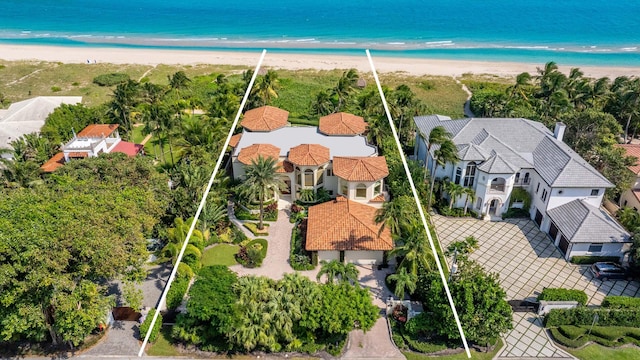 aerial view featuring a view of the beach and a water view