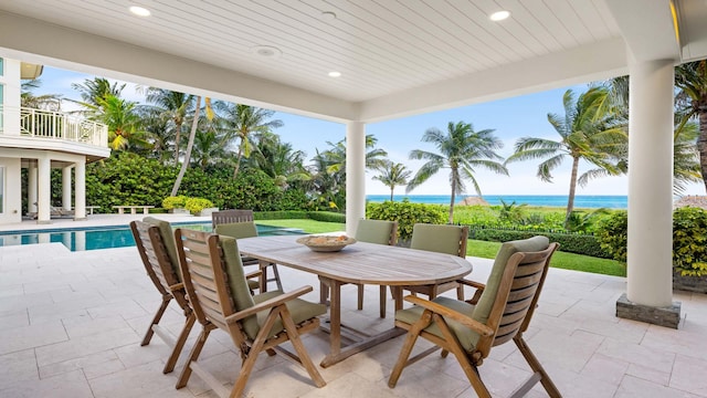 view of patio / terrace featuring a balcony and a water view