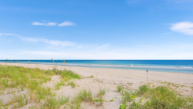 property view of water featuring a beach view