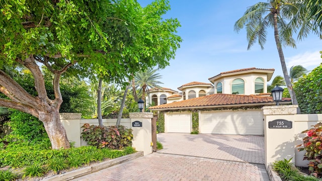 mediterranean / spanish-style house featuring a garage