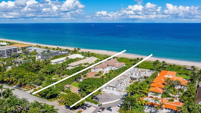 bird's eye view with a water view and a view of the beach