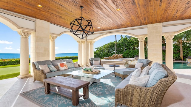 view of patio / terrace with outdoor lounge area and a water view