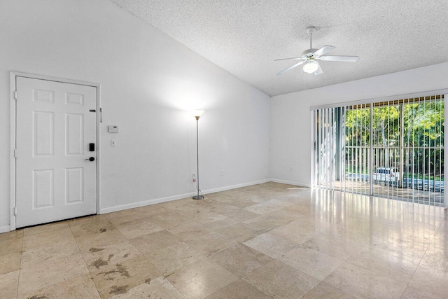 unfurnished room featuring ceiling fan and a textured ceiling