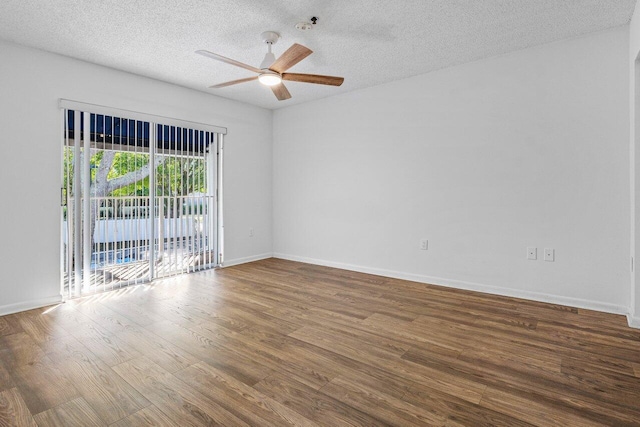 spare room featuring a textured ceiling, hardwood / wood-style flooring, and ceiling fan