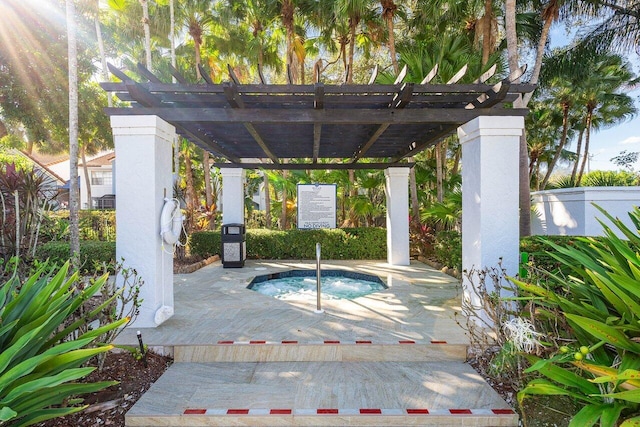 view of swimming pool featuring a patio area, a pergola, and a hot tub