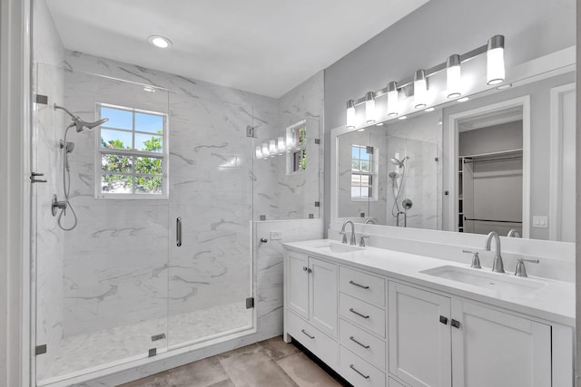 bathroom featuring vanity and walk in shower