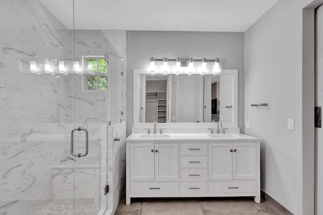 bathroom featuring vanity and an enclosed shower