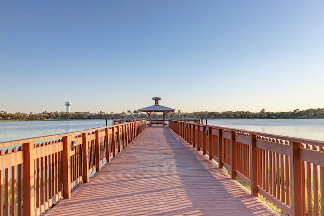 view of dock featuring a gazebo and a water view