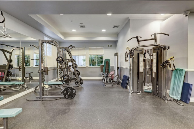 gym featuring a tray ceiling