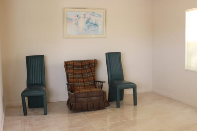 sitting room featuring light tile patterned floors