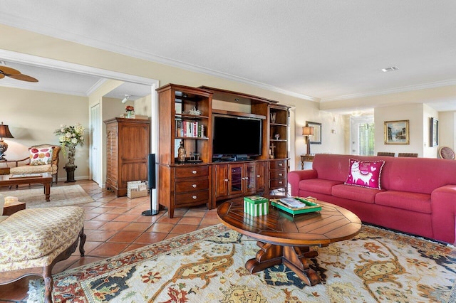 living area featuring crown molding, baseboards, visible vents, and light tile patterned floors