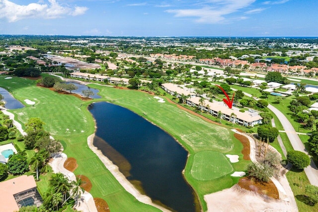 bird's eye view featuring a water view, view of golf course, and a residential view