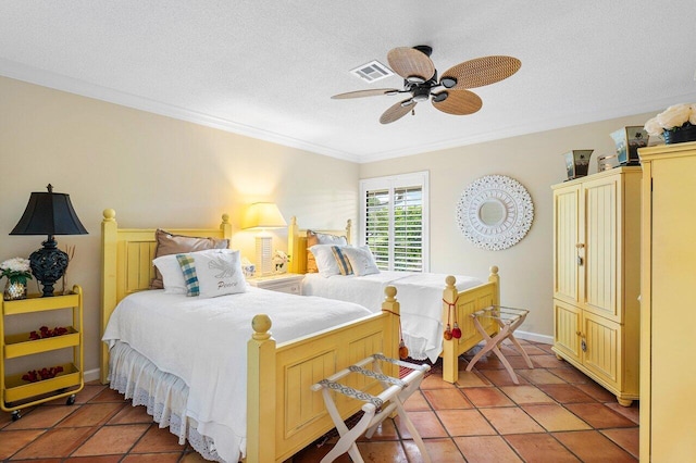 bedroom featuring visible vents, ornamental molding, a textured ceiling, a ceiling fan, and light tile patterned floors