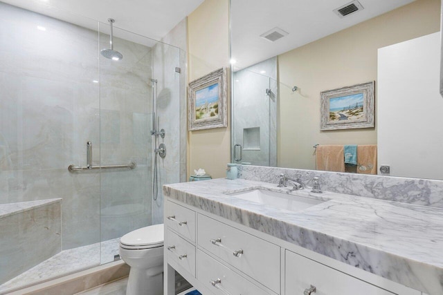 full bath with vanity, toilet, visible vents, and a stall shower