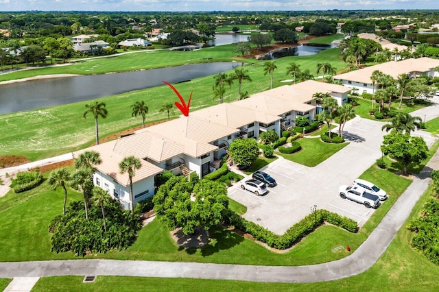 bird's eye view featuring a water view, golf course view, and a residential view
