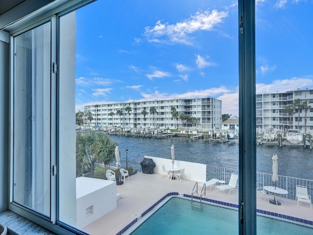 view of pool featuring a water view