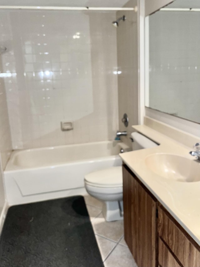 full bathroom featuring tile patterned flooring, vanity, toilet, and washtub / shower combination