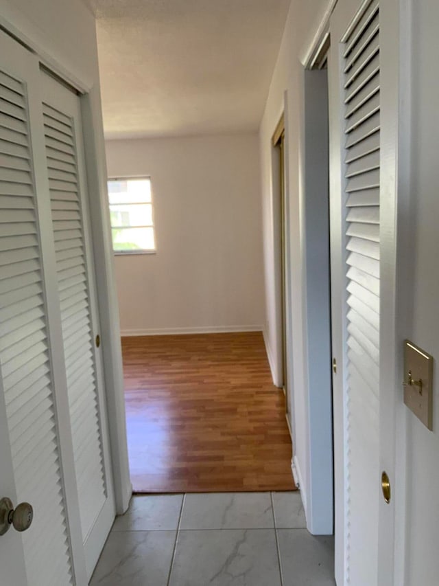 hall with light hardwood / wood-style floors