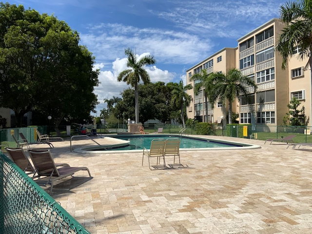 view of swimming pool featuring a patio area