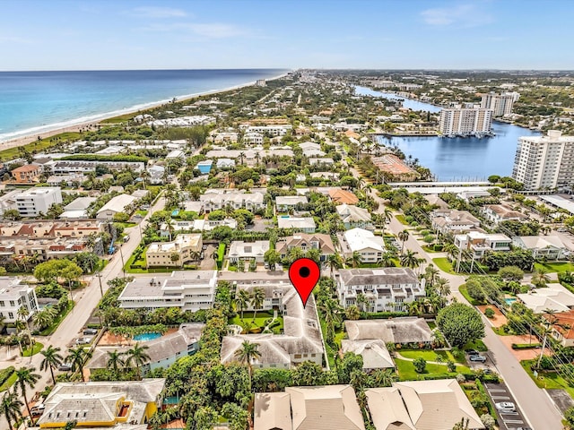 bird's eye view featuring a beach view and a water view