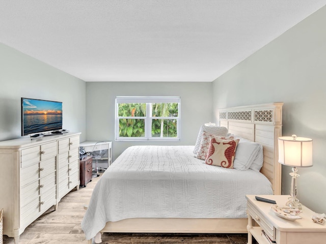 bedroom with light hardwood / wood-style floors