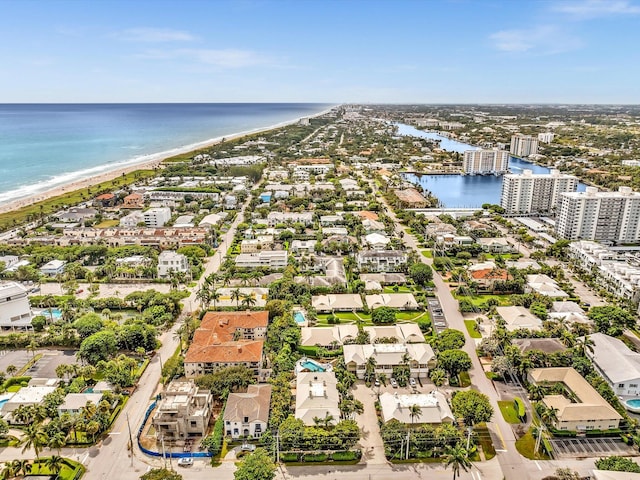 aerial view featuring a water view and a beach view