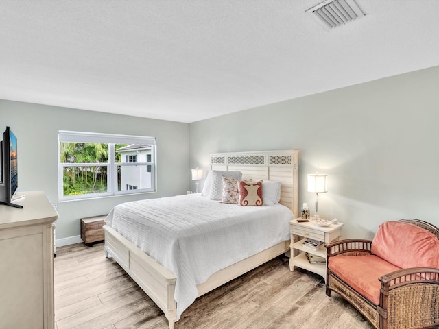 bedroom featuring light hardwood / wood-style flooring