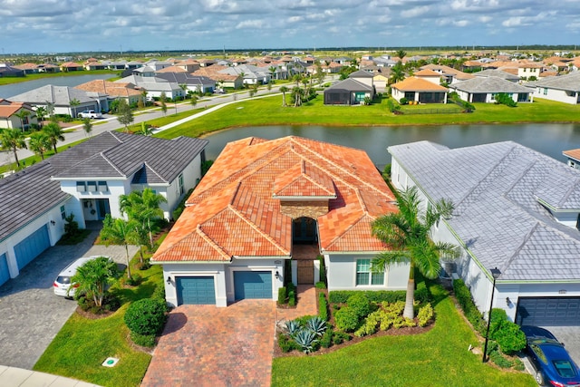 birds eye view of property with a water view