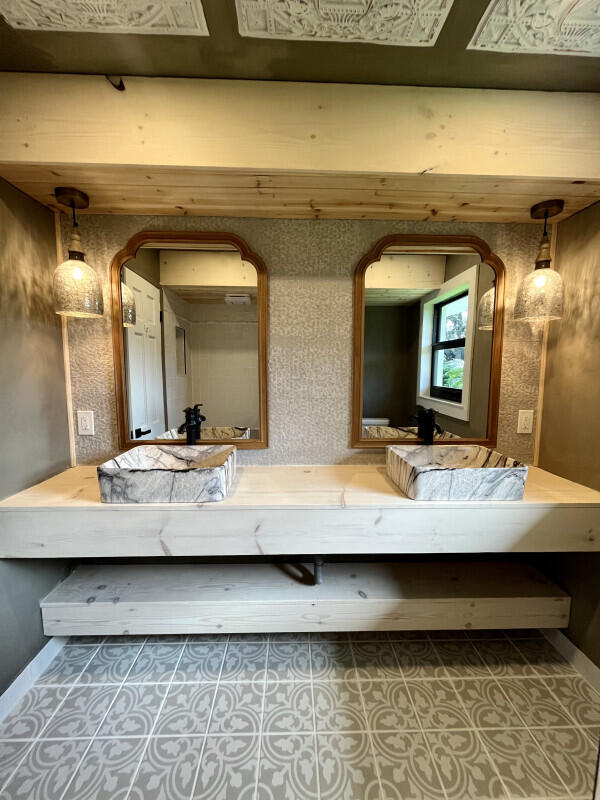 bathroom featuring tile patterned flooring and vanity