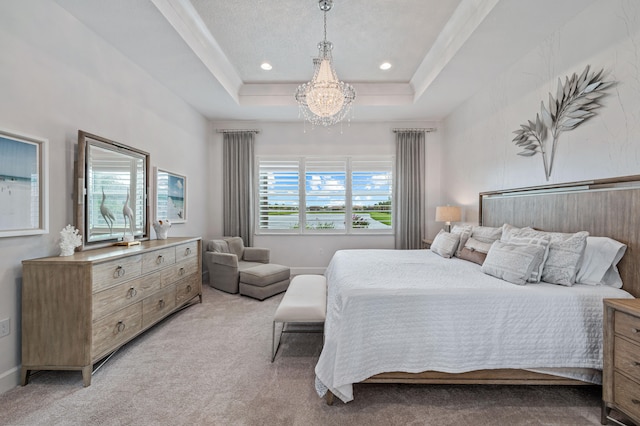 carpeted bedroom with multiple windows, a chandelier, and a raised ceiling