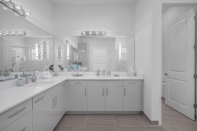 bathroom with vanity, toilet, plenty of natural light, and an enclosed shower