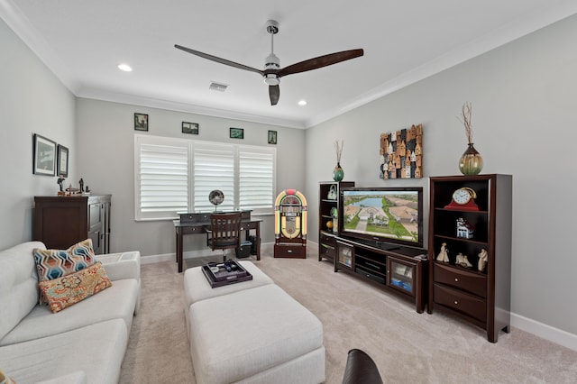 carpeted living room with crown molding and ceiling fan