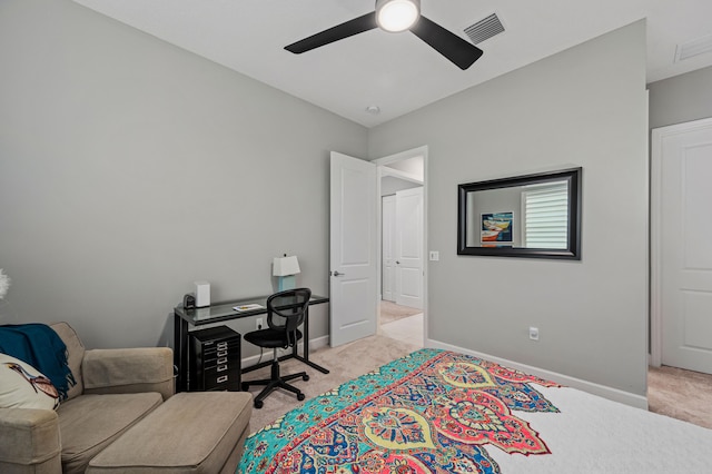 office with light colored carpet and ceiling fan