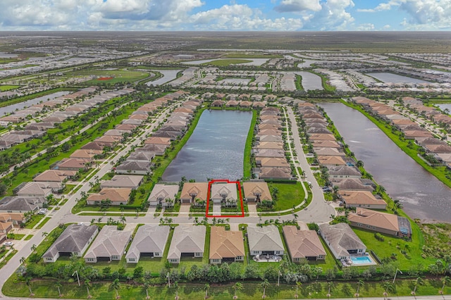 birds eye view of property featuring a water view