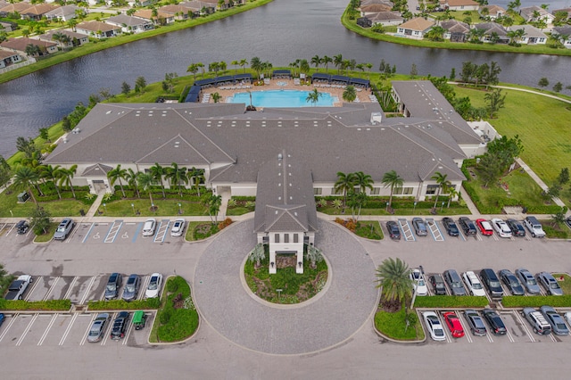 birds eye view of property featuring a water view