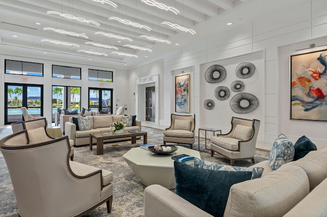 living room with french doors and crown molding