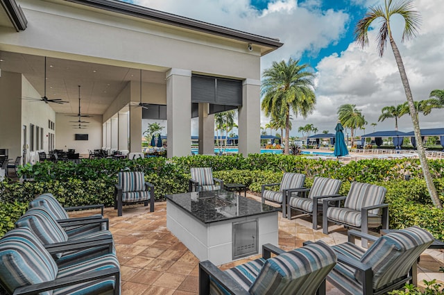 view of patio / terrace featuring a pool, an outdoor hangout area, and ceiling fan