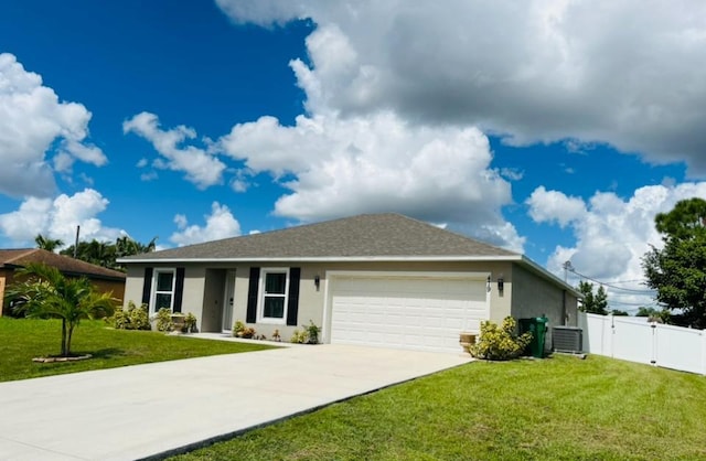 ranch-style house featuring a front yard, a garage, and central AC