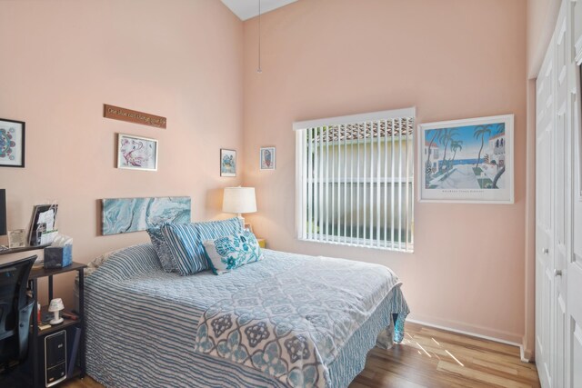 bedroom featuring light carpet, vaulted ceiling, and ceiling fan